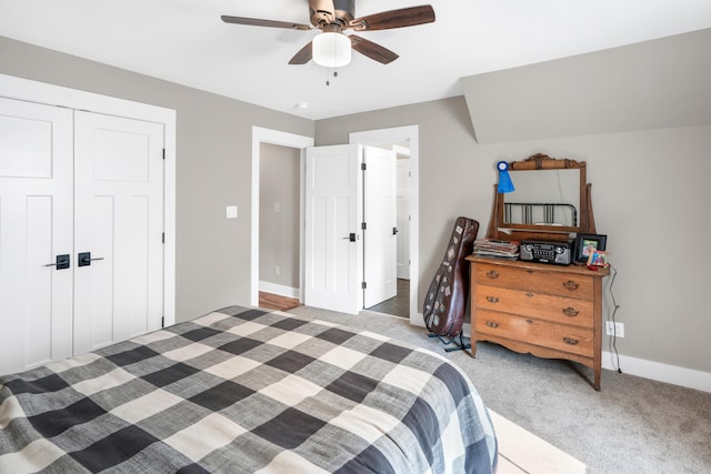 bedroom featuring light carpet, a closet, ceiling fan, and baseboards