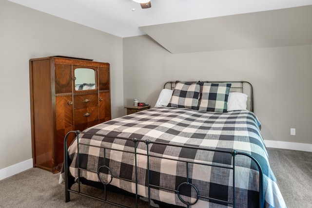 carpeted bedroom featuring baseboards and ceiling fan