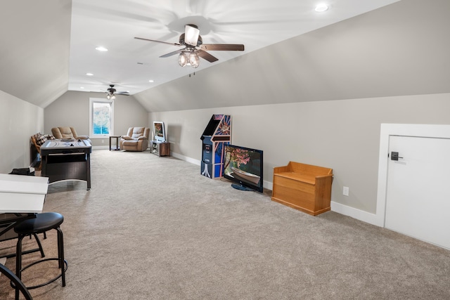 playroom featuring carpet floors, ceiling fan, vaulted ceiling, and baseboards