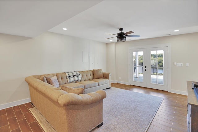 living room featuring french doors, dark wood-style flooring, baseboards, and recessed lighting