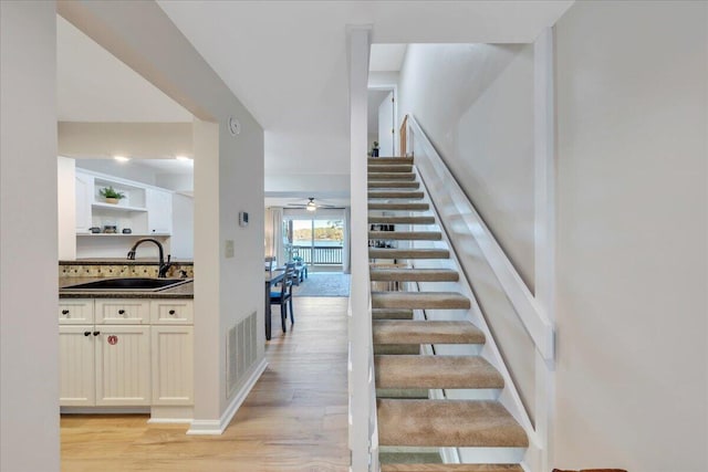 1791 Windlass Rd, Moneta, VA 24121 - stairway featuring a ceiling fan, visible vents, and wood finished floors