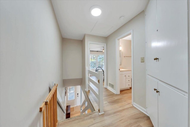 1791 Windlass Rd, Moneta, VA 24121 - corridor featuring an upstairs landing, visible vents, baseboards, and light wood-style floors
