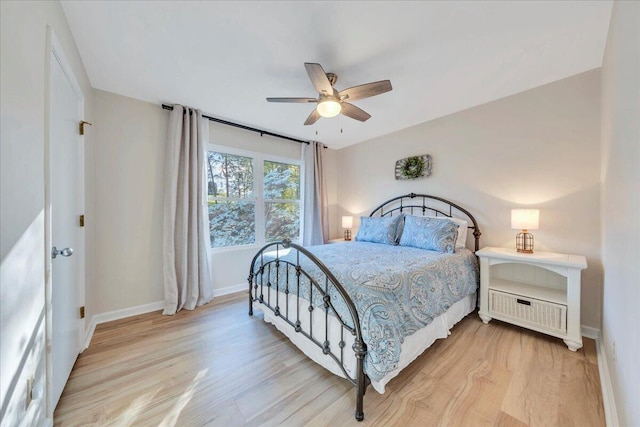 1791 Windlass Rd, Moneta, VA 24121 - bedroom featuring light wood-style floors, a ceiling fan, and baseboards