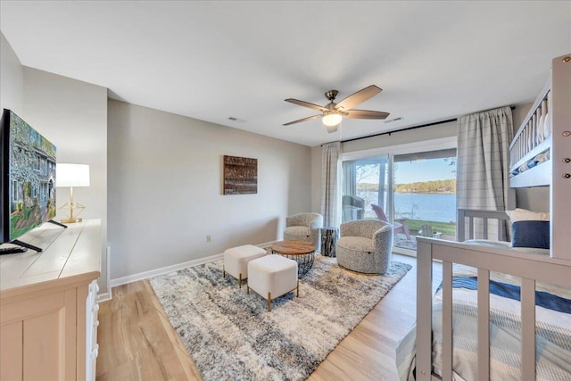 1791 Windlass Rd, Moneta, VA 24121 - living room featuring ceiling fan, a water view, visible vents, light wood-style flooring, and baseboards