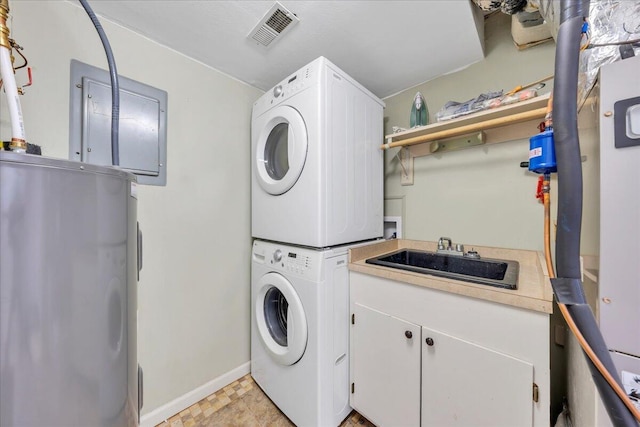 1791 Windlass Rd, Moneta, VA 24121 - laundry room featuring stacked washer / dryer, a sink, visible vents, baseboards, and cabinet space