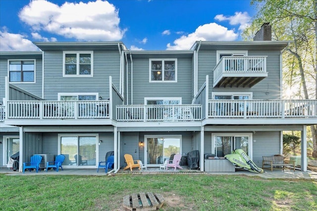 1791 Windlass Rd, Moneta, VA 24121 - back of house with a lawn, a chimney, a patio area, and a balcony