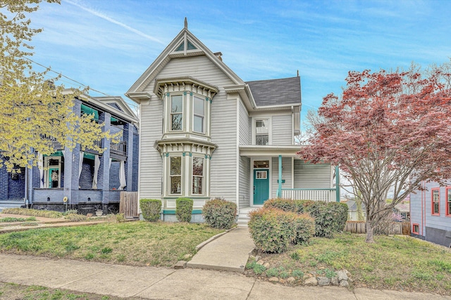 535 Day Ave SW, Roanoke, VA 24016 - victorian house featuring a front yard and a porch