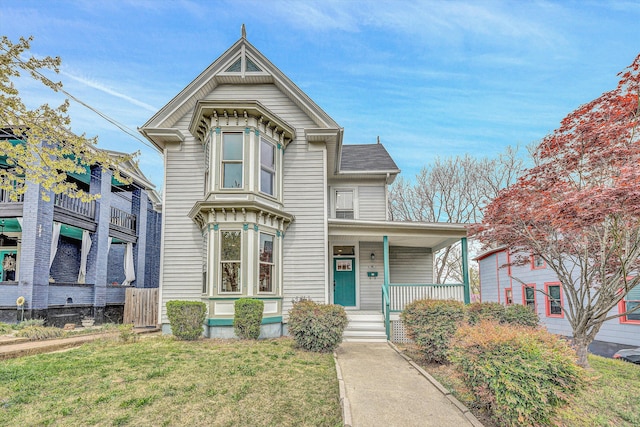 535 Day Ave SW, Roanoke, VA 24016 - victorian house with covered porch and a front yard