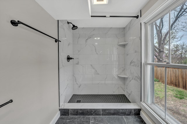 535 Day Ave SW, Roanoke, VA 24016 - bathroom featuring baseboards, tiled shower, and plenty of natural light