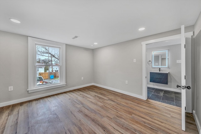 535 Day Ave SW, Roanoke, VA 24016 - spare room featuring baseboards and wood finished floors