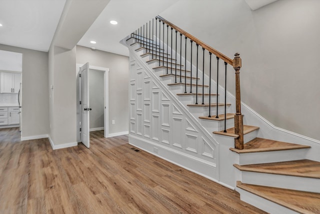 535 Day Ave SW, Roanoke, VA 24016 - stairs featuring wood finished floors, baseboards, visible vents, and recessed lighting