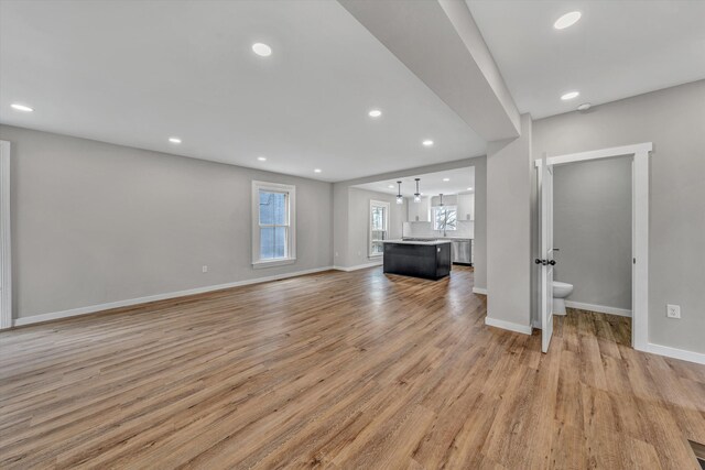 535 Day Ave SW, Roanoke, VA 24016 - unfurnished living room featuring recessed lighting, light wood-type flooring, and baseboards