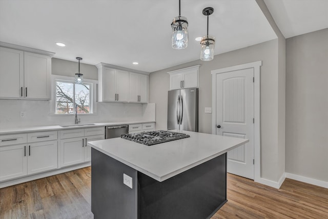 535 Day Ave SW, Roanoke, VA 24016 - kitchen with a sink, light countertops, light wood finished floors, and stainless steel appliances