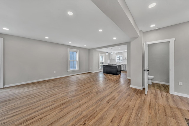 535 Day Ave SW, Roanoke, VA 24016 - unfurnished living room featuring healthy amount of natural light, light wood finished floors, and recessed lighting