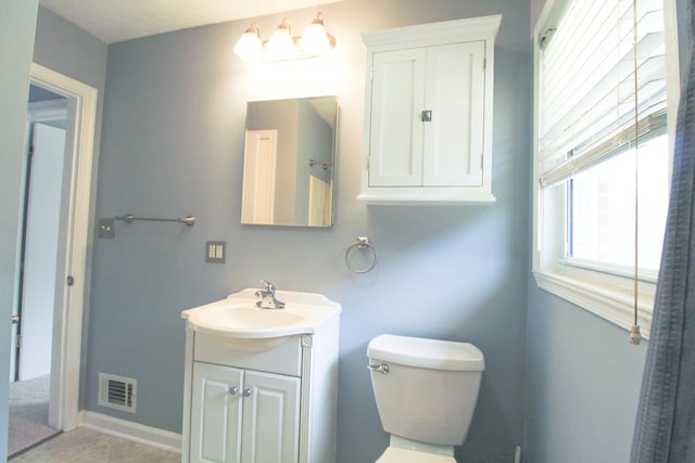 2048 Laura Rd NW, Roanoke, VA 24017 - bathroom featuring toilet, vanity, and visible vents