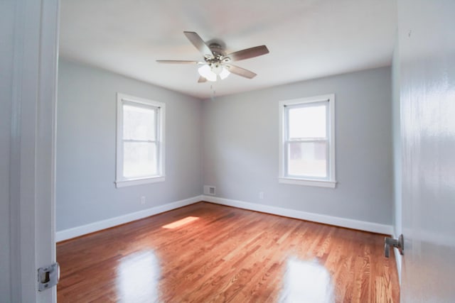 2048 Laura Rd NW, Roanoke, VA 24017 - empty room with baseboards, wood finished floors, and a healthy amount of sunlight