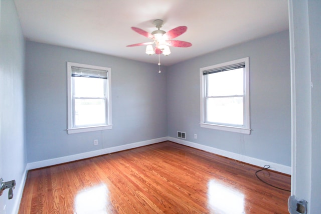2048 Laura Rd NW, Roanoke, VA 24017 - unfurnished room with visible vents, baseboards, light wood-style flooring, and a healthy amount of sunlight