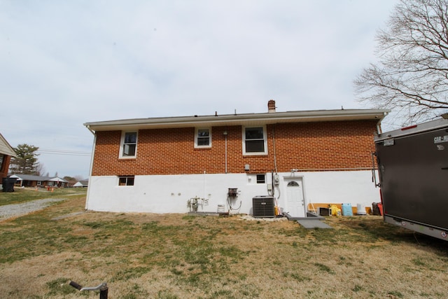 2048 Laura Rd NW, Roanoke, VA 24017 - back of house featuring brick siding, cooling unit, and a lawn