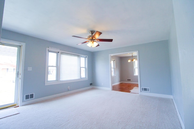 2048 Laura Rd NW, Roanoke, VA 24017 - carpeted empty room featuring baseboards, visible vents, and a wealth of natural light