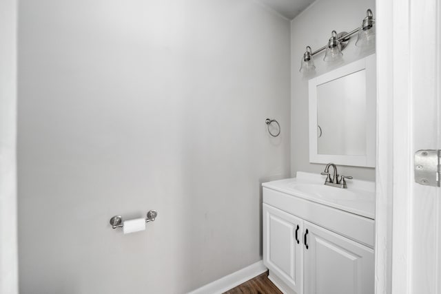 7222 Woods Crossing Dr, Roanoke, VA 24018 - bathroom with vanity, baseboards, and wood finished floors