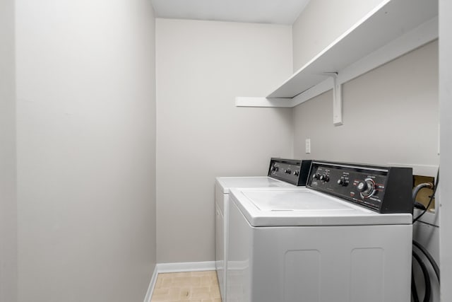 7222 Woods Crossing Dr, Roanoke, VA 24018 - clothes washing area featuring baseboards, washer and dryer, and laundry area