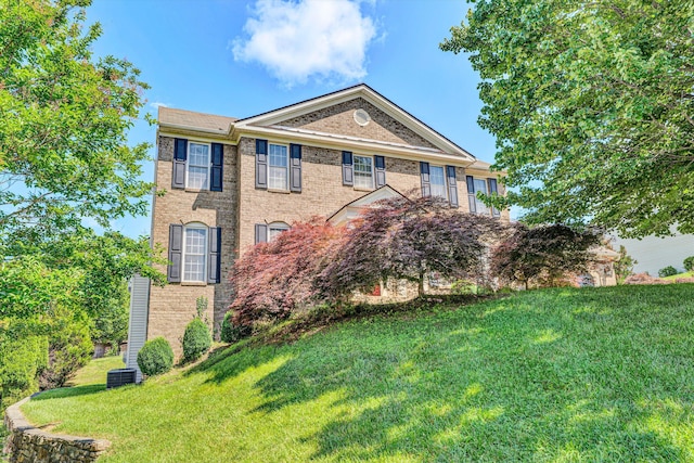 6206 Stone Manor Dr, Roanoke, VA 24018 - view of front facade with a front lawn, brick siding, and central AC unit