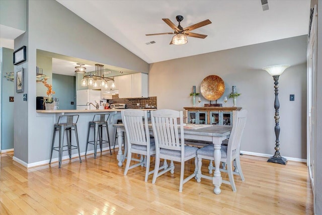 114 Waterside Cir Unit B-6, Moneta, VA 24121 - dining room featuring ceiling fan, vaulted ceiling, light wood-style floors, and baseboards