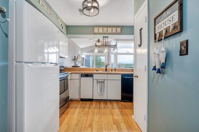 114 Waterside Cir Unit B-6, Moneta, VA 24121 - kitchen featuring freestanding refrigerator, black dishwasher, a sink, stainless steel electric stove, and light wood-style floors