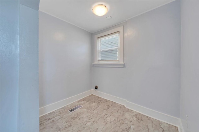 unfurnished room with visible vents, baseboards, and marble finish floor