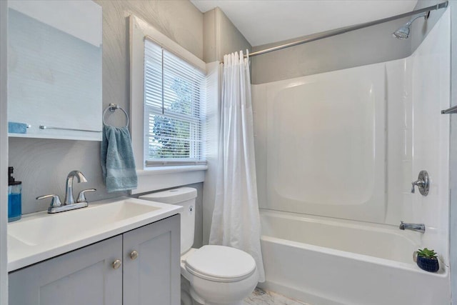 full bath with toilet, vanity, and shower / tub combo with curtain