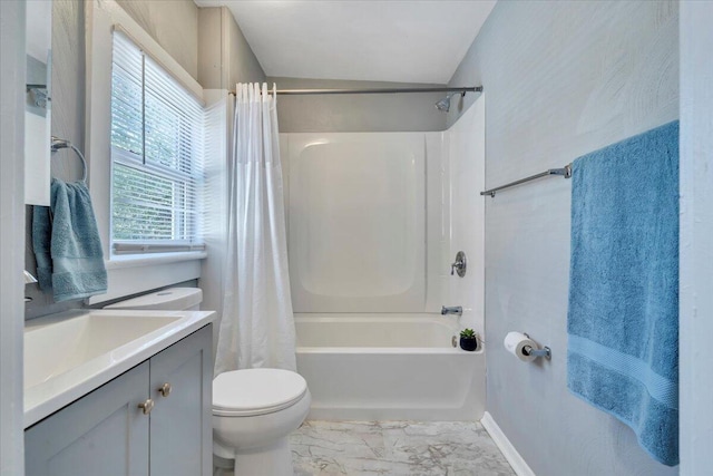 full bath featuring toilet, shower / bathtub combination with curtain, marble finish floor, and vanity