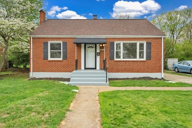4622 Eden Dr NW, Roanoke, VA 24012 - view of front of home with a chimney, a shingled roof, a front yard, and brick siding