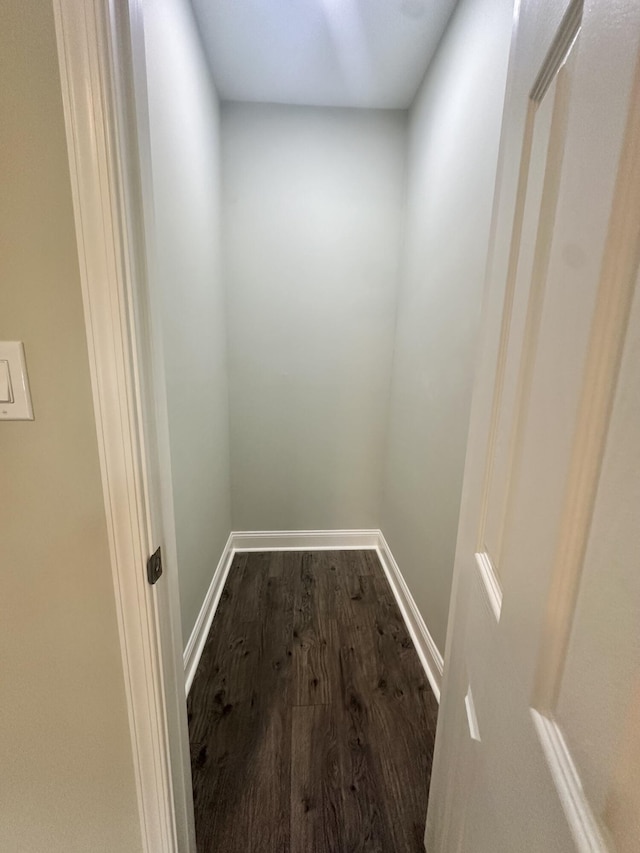 details featuring baseboards and wood finished floors