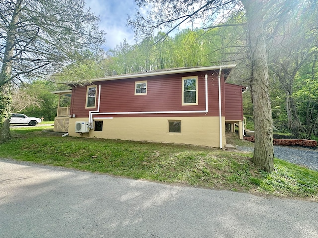 view of home's exterior with ac unit