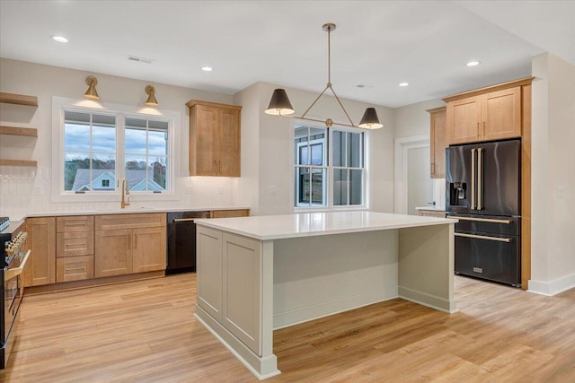120 Pointe O Woods Dr, Huddleston, VA 24104 - kitchen featuring black appliances, a sink, light wood-style flooring, light countertops, and recessed lighting