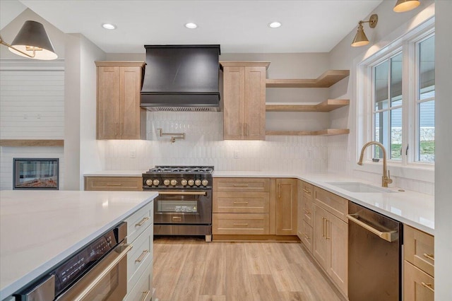 120 Pointe O Woods Dr, Huddleston, VA 24104 - kitchen with appliances with stainless steel finishes, custom range hood, light brown cabinets, a sink, and light wood finished floors