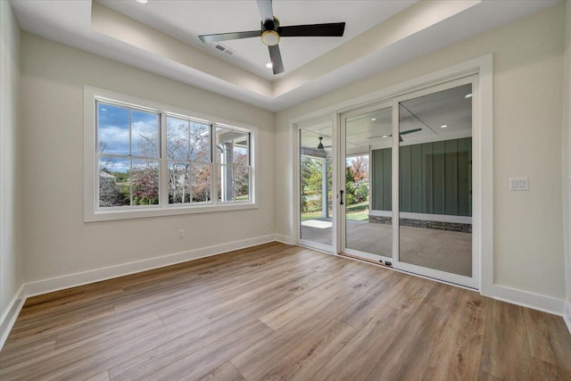 120 Pointe O Woods Dr, Huddleston, VA 24104 - empty room featuring wood finished floors, baseboards, a raised ceiling, and ceiling fan