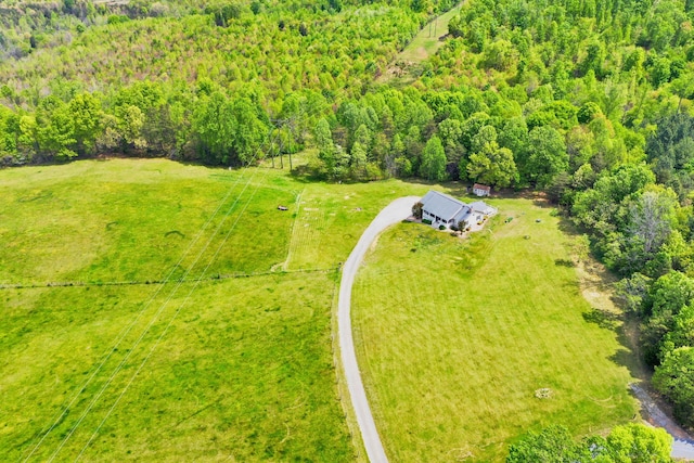 drone / aerial view featuring a forest view
