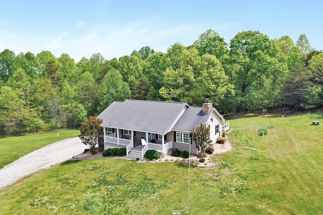 aerial view featuring a wooded view