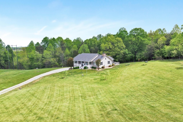 birds eye view of property with a forest view