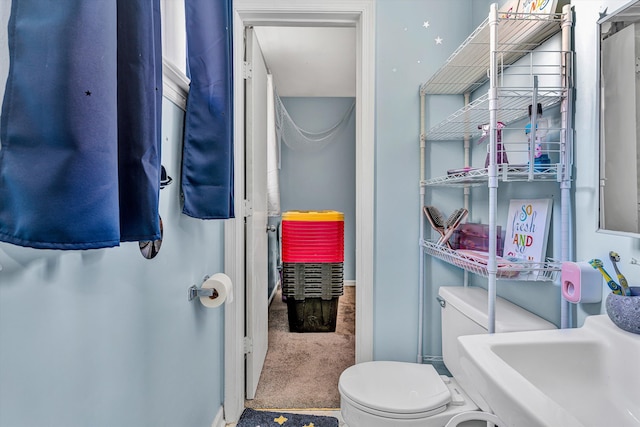 bathroom with a sink and toilet
