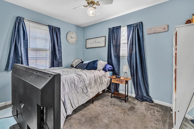 bedroom with carpet flooring, baseboards, and a ceiling fan