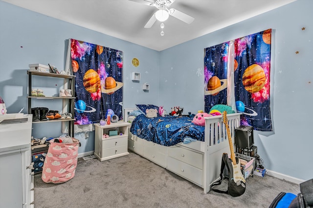 carpeted bedroom featuring baseboards and ceiling fan