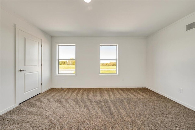 2227 Hendricks Store Rd, Moneta, VA 24121 - spare room with baseboards, ornamental molding, carpet flooring, and visible vents