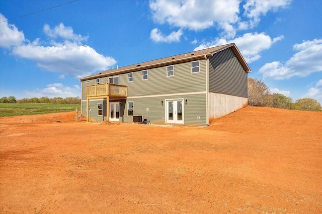2227 Hendricks Store Rd, Moneta, VA 24121 - back of house with central air condition unit, a wooden deck, and french doors