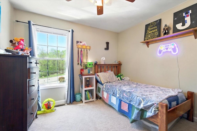carpeted bedroom with a ceiling fan