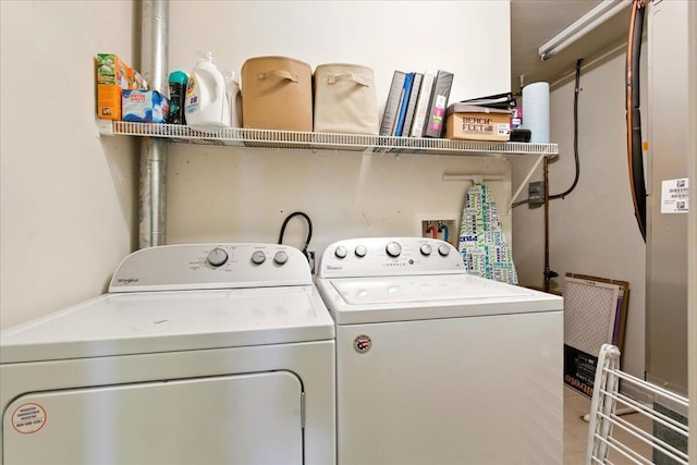 laundry room with washer and dryer and laundry area