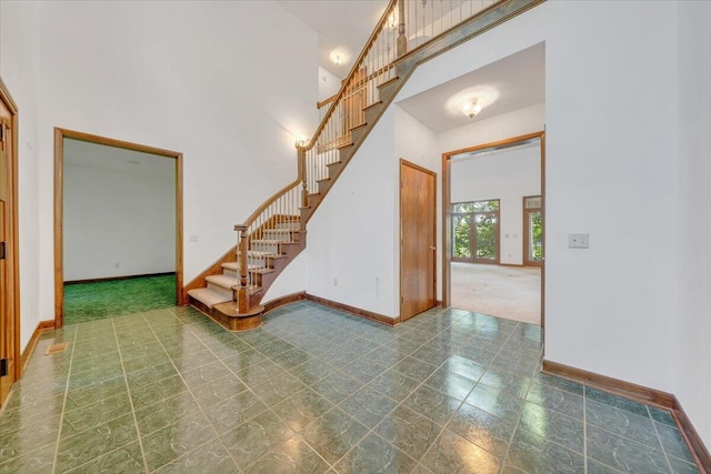 723 Fox Chase Rd, Wirtz, VA 24184 - foyer entrance featuring a high ceiling, baseboards, and stairway