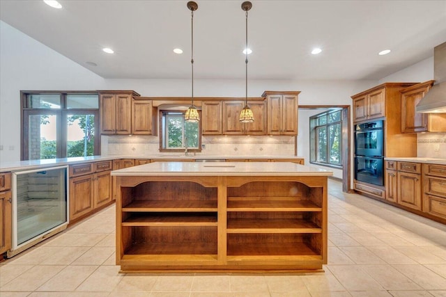 723 Fox Chase Rd, Wirtz, VA 24184 - kitchen with open shelves, wine cooler, brown cabinets, light countertops, and backsplash