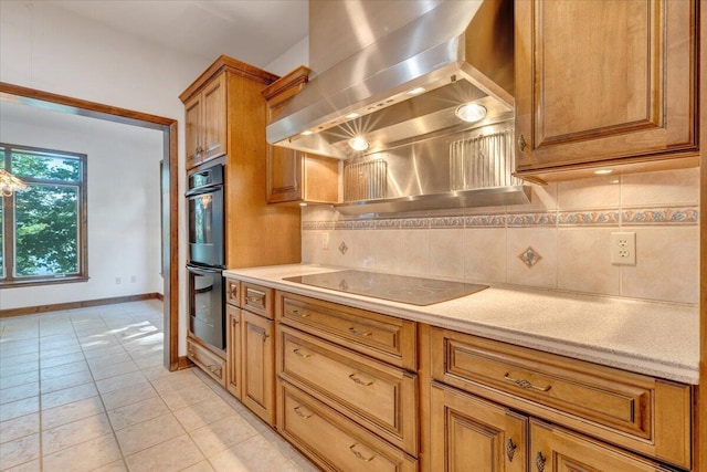 723 Fox Chase Rd, Wirtz, VA 24184 - kitchen featuring black appliances, wall chimney exhaust hood, decorative backsplash, brown cabinetry, and light tile patterned flooring